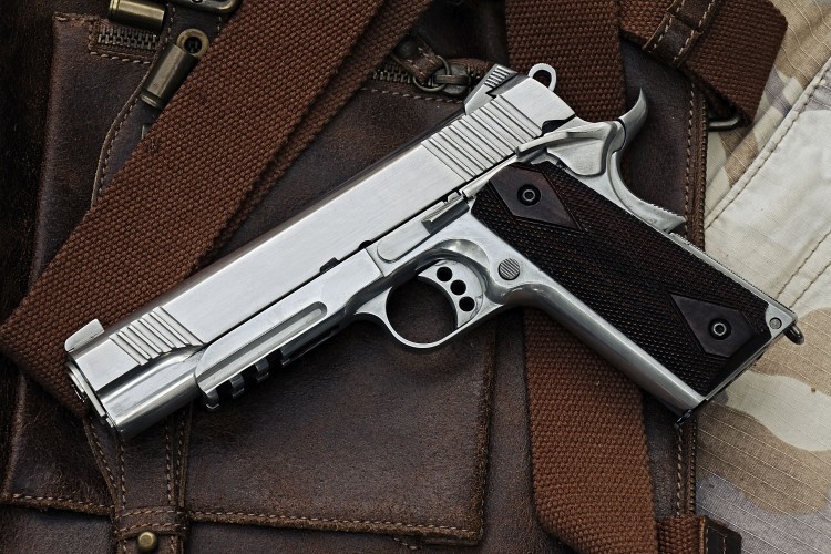 gun and leather bag